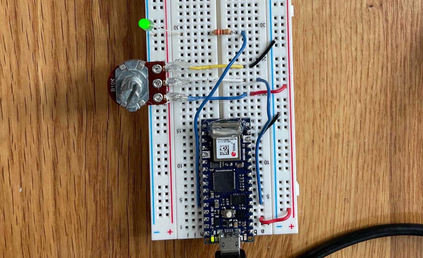 Breadboard with Nano 33 IOT, potentiometer,and single LED.