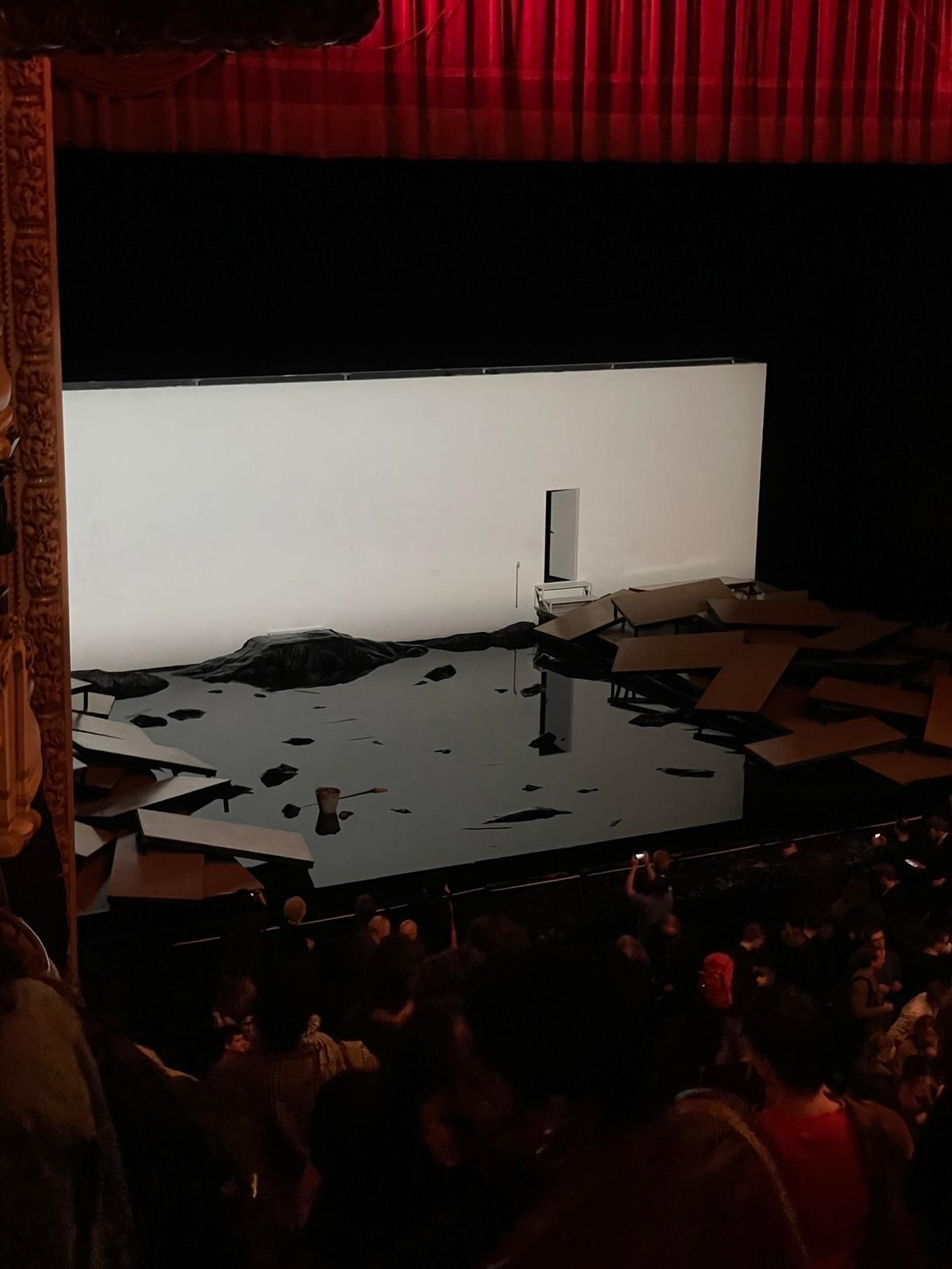 Image of the stage post-show, broken apart to reveal the water underneath